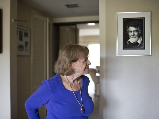 Shirley Ross, 95, stands in her bedroom where a photograph of her late husband. Ross spent nine years of living alone until Louis Rubin moved in one month ago. “I just decided it’s kind of lonely and I realized it would be nice having someone here,” Ross said.