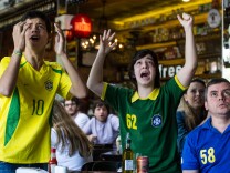 File: Brazilian football fans react as they watch the London 2012 Olympic men's soccer final match between Brazil and Mexico in Sao Paulo, Brazil on Aug. 11, 2012.