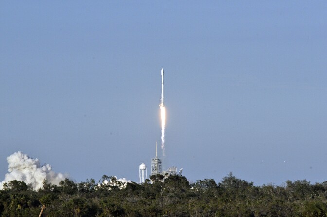 SpaceX's Falcon 9 rocket lifts off from space launch complex 39A at Kennedy Space Center, Florida on March 30, 2017, with an SES communications satellite.  
SpaceX blasted off a recycled rocket for the first time on, using a booster that had previously flown cargo to the astronauts living at the International Space Station. / AFP PHOTO / BRUCE WEAVER        (Photo credit should read BRUCE WEAVER/AFP/Getty Images)