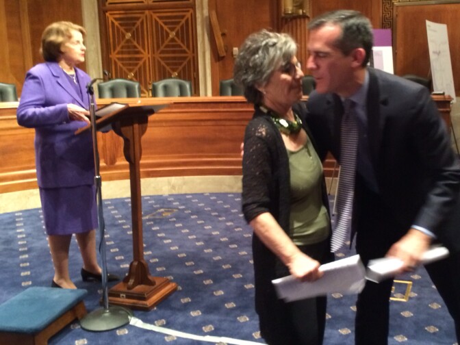 LA Mayor Eric Garcetti has a kiss for Senator Barbara Boxer's help securing $1.25 billion for the Purple Line Extension. Senator Dianne Feinstein also celebrates the California cash announcement.