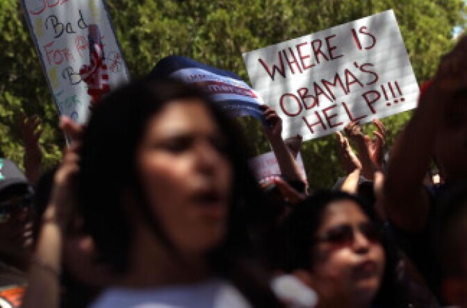 Opponents of Arizona's new immigration enforcement law protest outside the state capitol building on April 25, 2010 in Phoenix, Arizona