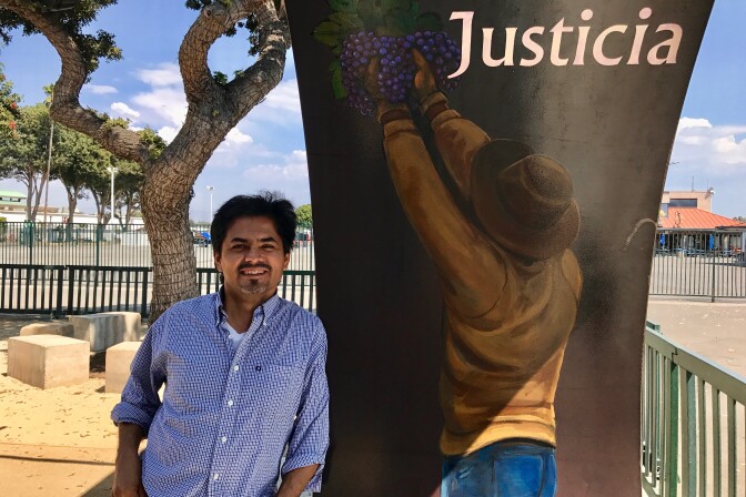 Artist Emigdio "Higgy" Vasquez's images of farmworkers adorn the inside of the portal leading to the agricultural workers memorial at the OC fairgrounds, Aug. 31, 2017. 