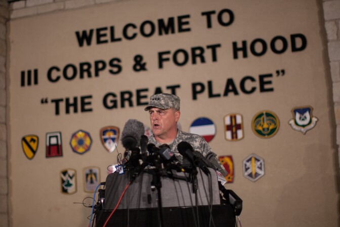 Lt. Gen. Mark Milley, commanding general of III Corps and Fort Hood, speaks with the media outside of an entrance to the Fort Hood military base following a shooting that occurred inside, Wednesday, April 2, 2014, in Fort Hood, Texas. Four people were killed, including the gunman, and 16 were wounded in the attack, authorities said.
