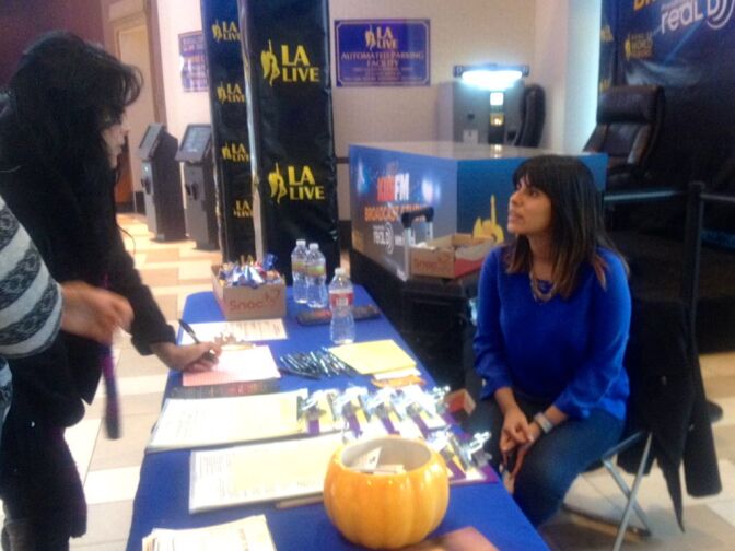 Jacqueline Andrade, a blood donor recruiter at Children's Hospital Los Angeles, tells moviegoers about the blood drive.