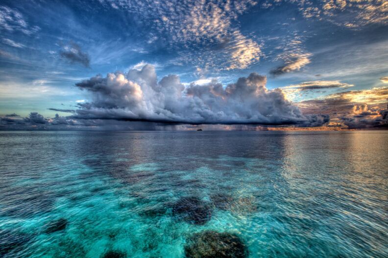 The 200-island nation of the Maldives exists mostly within a meter of sea level. As seas rise, it's threatened, but changing temperature and ocean acidification are problems for seafood-eating residents, too. 