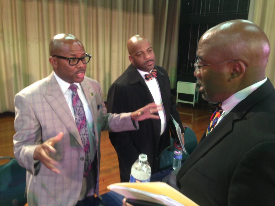 State Assemblyman Mike Gipson, left, and State Senator Isadore Hall, center, talk to Inglewood Unified state administrator Vince Matthews.