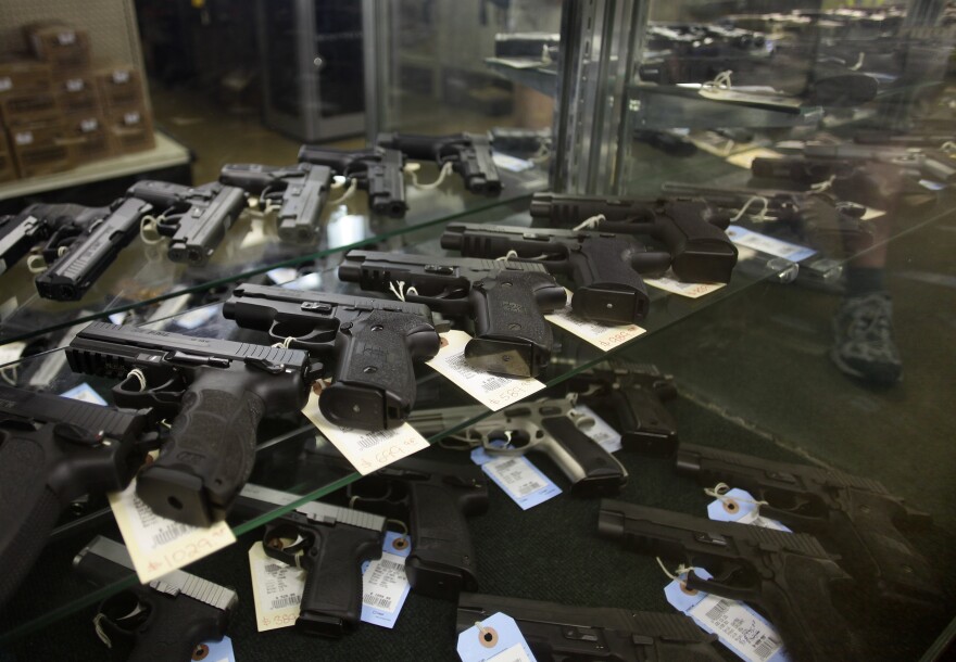 AURORA, CO - JULY 22: Hand guns are displayed at Firing-Line July 22, 2012 in Aurora, Colorado. Firing-Line is located not far from where suspect gunman James Eagan Holmes, 24, is accused of killing 12 people at a screening of the new "Batman" film last Friday. (Photo by Joshua Lott/Getty Images)
