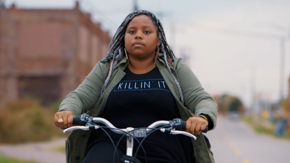 Dextina Booker rides her bike to work in Detroit in "Generation Startup."