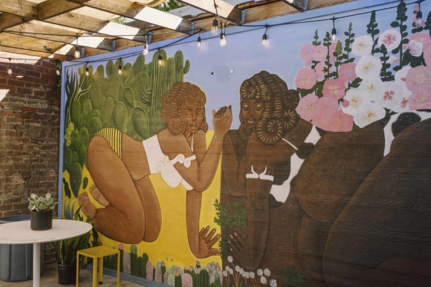 A mural on the walls of the courtyard at Kindred Space LA.