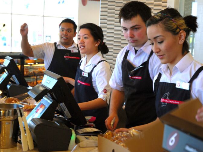 WEST COVINA, Calif. -- Storefront employees ring up customers during the lunch rush at the new 85°C Bakery Cafe on Jan. 16. This company-owned West Covina location is the third to open in the United States, with more openings planned throughout Southern California. The Taiwan-based chain, while new to the U.S. market, operates more than 700 stores worldwide.