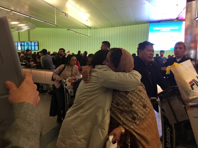 Nalia Shah of Rolling Hills, right, greets her 65-year-old mother, Rabia, at LAX on Saturday, Jan. 28, 2017. Her mother and father are green card holders traveling from Pakistan, a country not on the list targeted by President Trump's ban on Muslim-majority countries. Nonetheless, they were kept waiting for four hours before released.