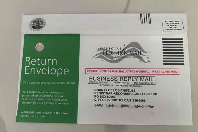 A return envelope has a visible hole at top left. Envelope is addressed to the Registrar-Recorder/County Clerk