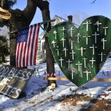 Some of the remaining memorial items to Sandy Hook Elementry students and staff who died are viewed in Newtown, Connecticut on January 3, 2013. Students at the elementary school where a gunman massacred 26 children and teachers last month were returning Thursday to classes at an alternative campus described by police as 'the safest school in America.' Survivors were finally to start their new academic year in the nearby town of Monroe, where a disused middle school has been converted and renamed from its original Chalk Hill to Sandy Hook. 
