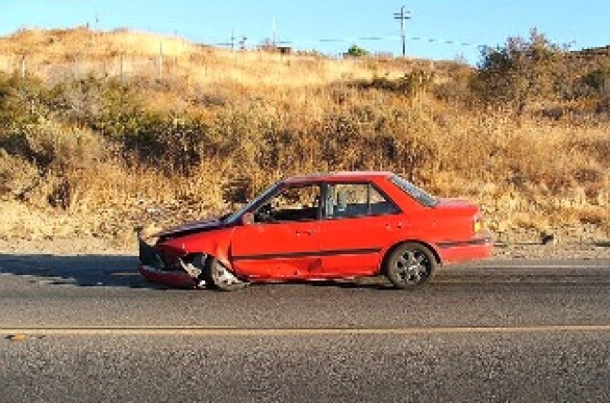 A crashed automobile on a Southern California street.