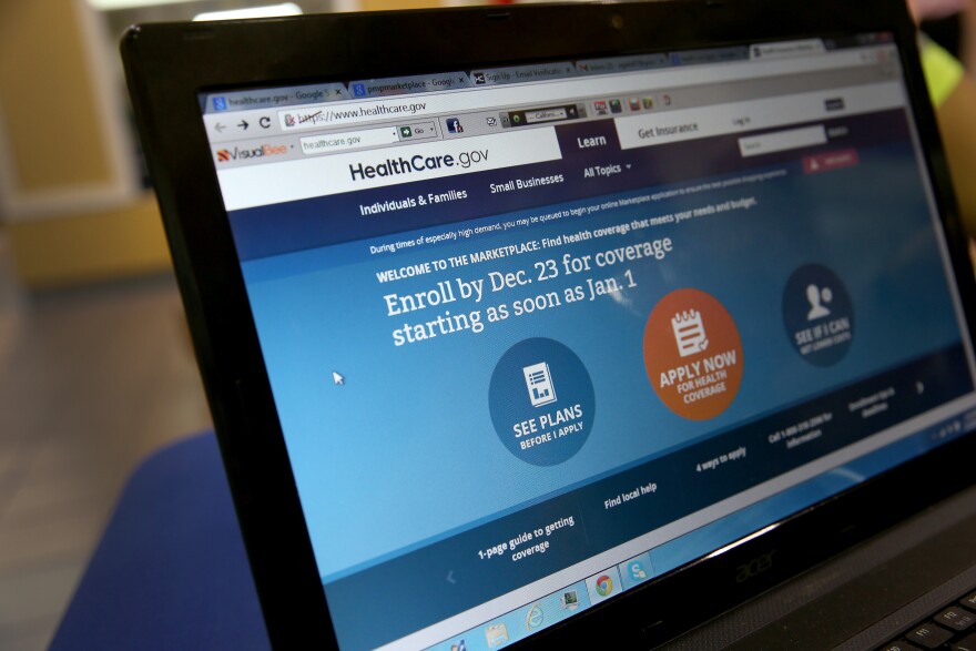 A computer screen reads, "Enroll by Dec. 23 for coverage starting as soon as Jan 1." as agents from Sunshine Life and Health Advisors help people purchase health insurance under the Affordable Care Act at the kiosk setup at the Mall of Americas on December 22, 2013 in Miami, Florida.  