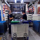 Employees work on automobile parts at a production line at the BMW factory in Shenyang, China on Nov. 22. Twelve percent of workers in China could need to switch jobs by 2030, researchers say.