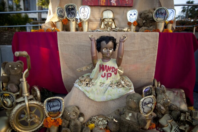 This Dia de Los Muertos alter in Grand Park titled "Life not Toys" is dedicated to all children of war-torn regions.