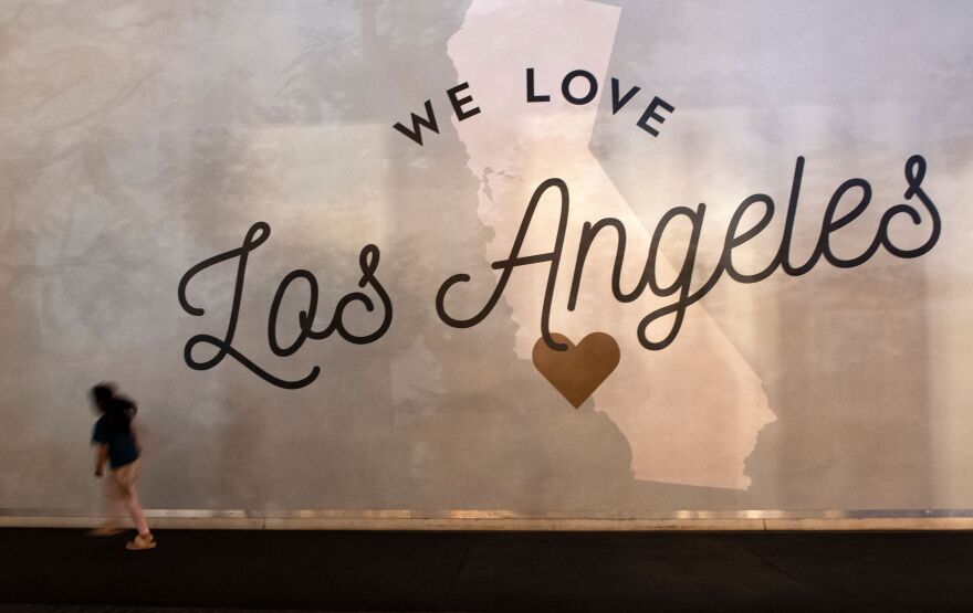 The words "We Love Los Angeles" are in a large format mural that depicts the shape of California with a heart locating