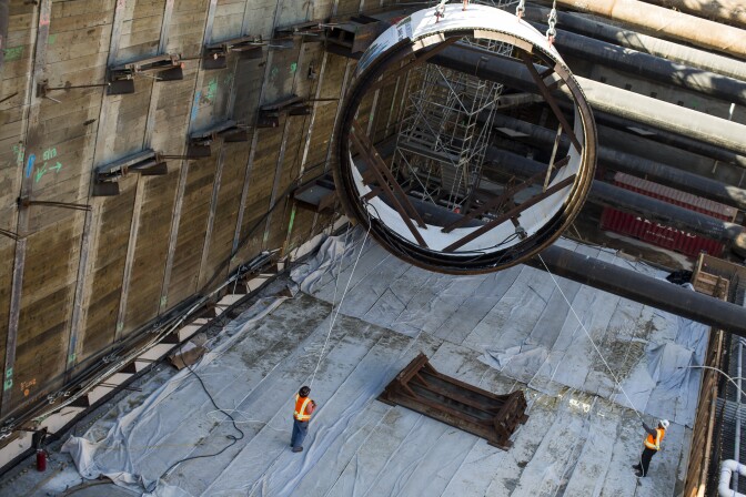 A segment of a tunnel boring machine is lowered into the Regional Connector Transit Project in Little Tokyo on Wednesday morning, Oct. 29, 2016. The 1.9-mile underground light rail system will connect Metro Rail's Gold Line to the 7th Street Metro Center.