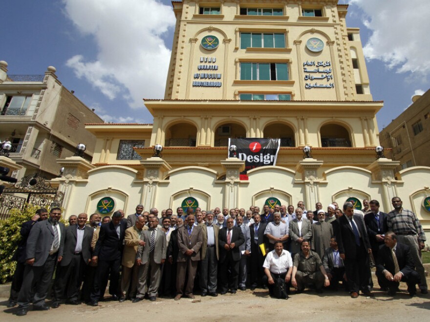 Egyptian Muslim Brotherhood Shura council members gather outside the new Muslim Brotherhood headquarters in Cairo on April 30.