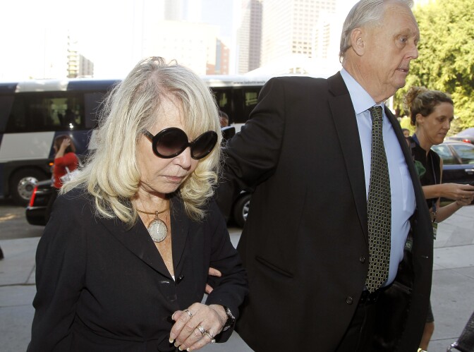 Shelly Sterling, the estranged wife of Los Angeles Clippers owner Donald Sterling, arrives at a Los Angeles courthouse with her attorney Pierce O' Donnell, Monday, July 7, 2014. With the potentially record-breaking $2 billion sale of the Clippers hanging in the balance, a trial beginning Monday will focus on Shelly Sterling had the authority under terms of a family trust to unilaterally negotiate the deal.  (AP Photo/Nick Ut)