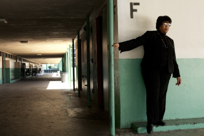 Joyce Randall stands in the hallway near her old classroom at Inglewood High School.