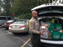 Deputy Justin Cham packs his car full of Thanksgiving dinners destined for the families of sheriff's employees deployed in Iraq.