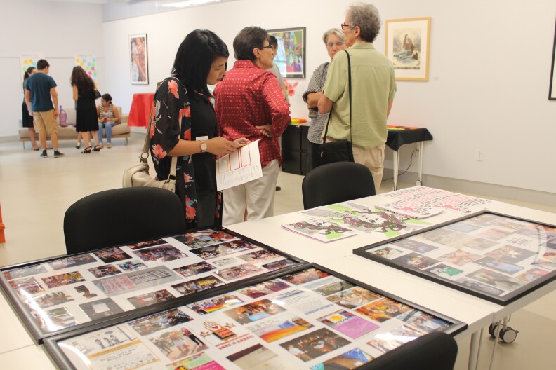 Visitors mingle and view displays at the opening celebration of Mi Centro. The location is a new outpost in Boyle Heights as a collaboration between the Los Angeles LGBT Center and the Latino Equality Alliance.