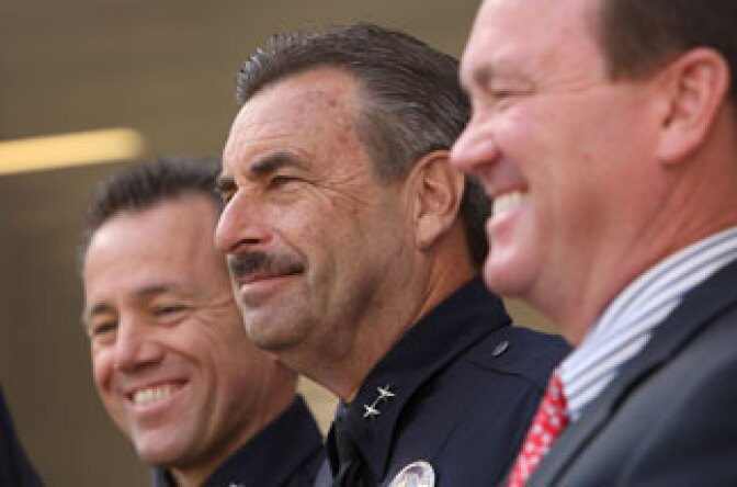 The three final candidates for the job of Los Angeles Police Chief, Deputy Chief Michel Moore, Deputy Chief Charlie Beck and Assistant Police Chief Jim McDonnell listen as Chief William Bratton holds his last press conference outside the new Police Administration Building on October 28, 2009.