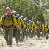 "Supe" Eric Marsh (Josh Brolin) leads the Granite Mountain Hotshots up the trail at Yarnell Hills--including, generally in this order: Travis Carter (Scott Foxx), Dustin Deford (Ryan Busch), Garret Zuppiger (Brandon Bunch), Andrew Ashcraft (Alex Russell), Wade Parker (Ben Hardy), Scott Norris (producer Thad Luckinbill), Anthony Rose (Jake Picking), Travis Turbyfill (Geoff Stults), Chris MacKenzie (Taylor Kitsch), Brendan McDonough (Miles Teller), Joe Thurston (Matthew Van Wettering), Kevin Woyjeck (Michael McNulty), Grant McKee (Sam Quinn), Billy Warneke (Ryan Jason Cook), John Percin, Jr. (Nicholas Jenks), Sean Misner (Kenny Miller), Robert Caldwell (Dylan Kenin), Clayton Whitted (Scott Haze), Jesse Steed (James Badge Dale) in Columbia Pictures' ONLY THE BRAVE, THE TRUE STORY OF THE GRANITE MOUNTAIN HOTSHOTS.