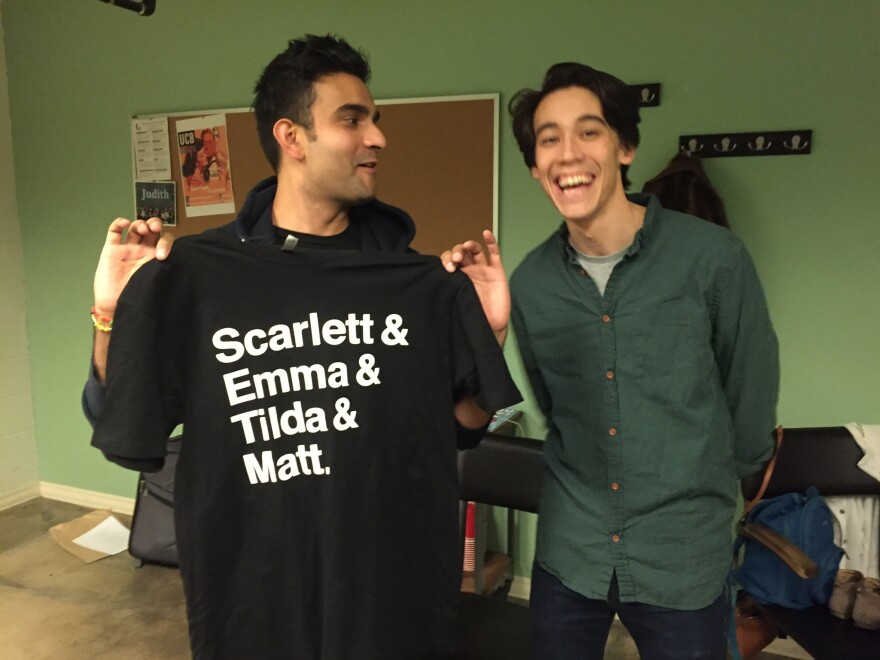 Dhruv Uday Singh and Zach Oyama perform and coach at UCB. Singh models the T-shirt for sale at the show.
