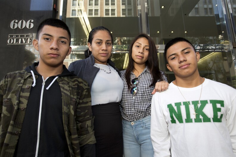 Left to right: Luis González (16), his mother Ana Hernández, sister Mariela Michell Beltrán-Hernandez (15)  and brother Alejandro González (16), stand on the steps of L.A.’s immigration court in downtown just ahead of a court date for their younger sister on Friday August 12th, 2016. Mariela arrived in the U.S. in March 2016 to reunite with her older brothers and mother after years of separation. She now faces an immigration judge to fight her deportation from the U.S. She is seeking asylum to remain in the U.S. She said she fled gang violence in her home country of El Salvador.