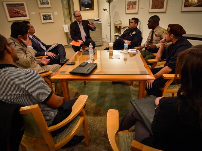 AirTalk's Larry Mantle facilitates a conversation with cops and community members on the future of policing in SoCal. 