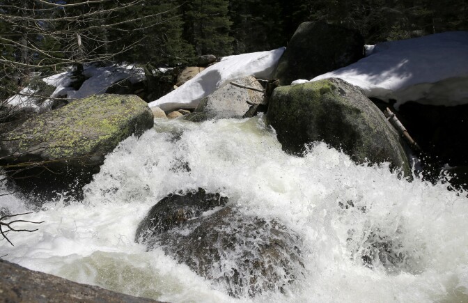 Water from snow melt cascades down the South Fork of the American River, Monday, May 1, 2017, near Echo Summit, Calif. Warming springtime temperatures in California are expected to accelerate melting of the state's record snowpack, sending water surging due to the heaver-than-normal runoff. (AP Photo/Rich Pedroncelli)