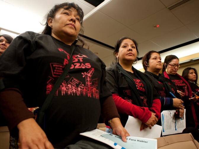Members of the Esperanza Community Housing Corporation attend a town hall meeting discussing recent findings from air monitoring and enforcement efforts related to AllenCo Energy, Inc. in the University Park. The meeting was hosted by the South Coast Air Quality Management District on Wednesday at Mount St. Mary's College.