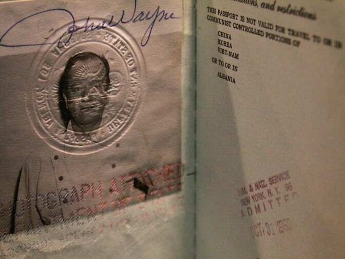 John Wayne's passport was among the items to be auctioned off today. The auction is expected to rake in $1.5 million.