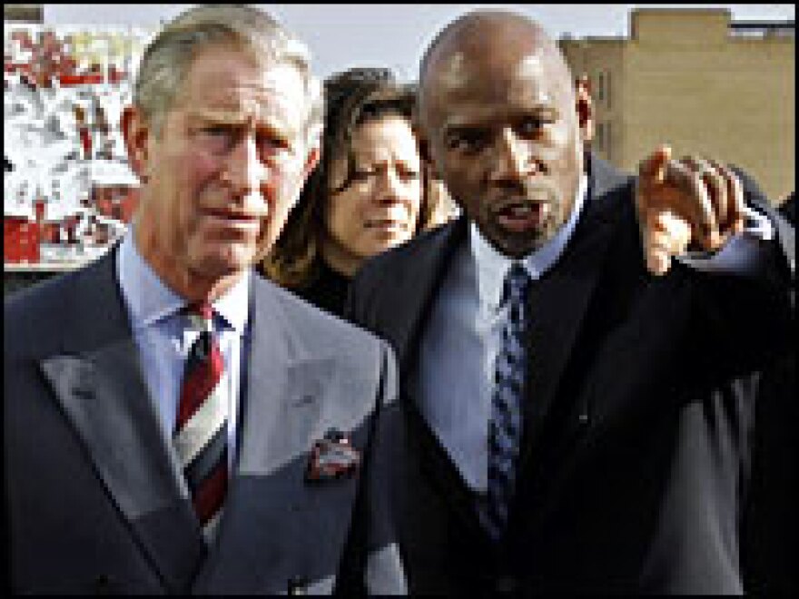 Education and social-services visionary Geoffrey Canada (right) leads Britain's Prince Charles on a 2007 tour of the Harlem Children's Zone.