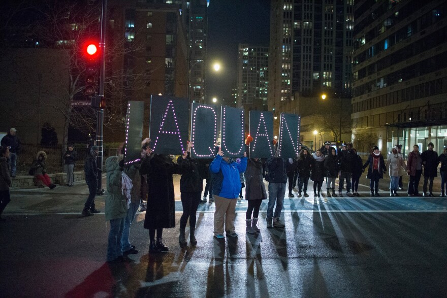 Demonstrators march through downtown following the release of a video showing Chicago Police officer Jason Van Dyke shooting and killing Laquan McDonald on November 24, 2015 in Chicago, Illinois. 