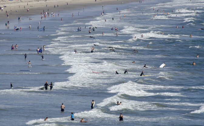 File: Swimmers enjoy waters of Pacific near the famous Santa Monica Pier on Aug. 20, 2013.