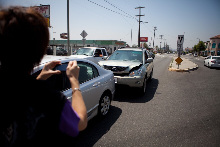 SAN GABRIEL, CA - JUNE 11: Hin Lee takes a photo of his car after getting into a accident at the 400 block of South San Gabriel Boulevard June 11, 2012 in San Gabriel, California. This intersection was the scene of the first of two accidents that occurred June 9, involving Commerce Secretary Bryson. The Commerce Department has said that Bryson had suffered seizures.  (Photo by Jonathan Gibby/Getty Images)
