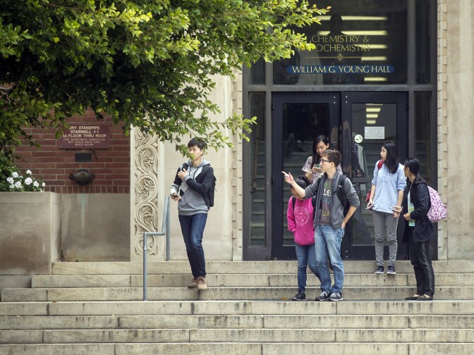 Students emerge from Young Hall after a lockdown is lifted on Wednesday, June 1, 2016 following a murder-suicide on the University of California, Los Angeles campus.