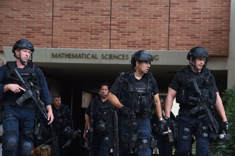 Los Angeles Police Department officers patrol the University of California Los Angeles (UCLA) campus after a shooting, June 1, 2016, in Los Angeles, California.
Two people were confirmed dead on Wednesday following a shooting at the University of California's Los Angeles campus, police said. "We have confirmation of two people killed for now," police spokeswoman Jenny Houser told AFP, adding that the identity of the victims was unclear. / AFP / ROBYN BECK        (Photo credit should read ROBYN BECK/AFP/Getty Images)