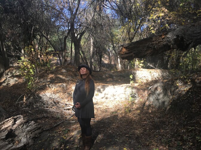 Shannon O'Sullivan in a dry creek within the Hahamongna Watershed Park in Pasadena. She objects to trees being cleared from part of the park to make way for sediment removal behind Devil's Gate Dam. 