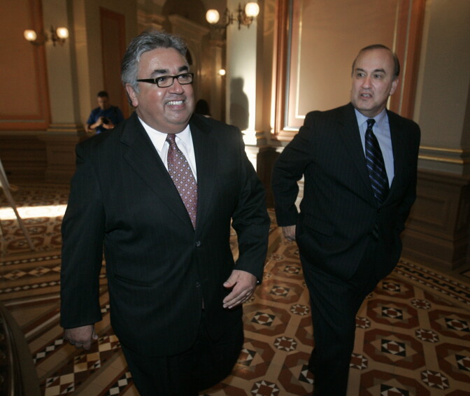 State Sen. Ron Calderon, D-Monterey Park, left, smiles as he walks through the Capitol with his brother, former assemblyman Charles Calderon, D-Whittier, after his early primary measure was approved by the Assembly at the Capitol in Sacramento, Tuesday, March 6, 2007.