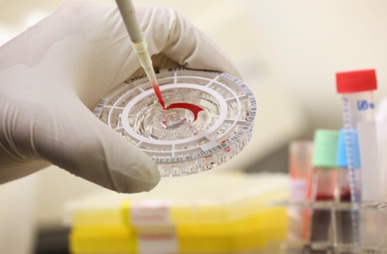 BERLIN, GERMANY - AUGUST 11:  A doctor for tropical medicine prepares a blood sample for analysis during a demonstration for the media of ebola treatment capabilities at Station 59 at Charite hospital on August 11, 2014 in Berlin, Germany. The specialized quarantine unit at Station 59 is among a handful of facilities in Germany nationwide that are capable of handling ebola cases. According to media reports a German medical student currently in Ruanda is showing signs of the disease, though should he in fact have ebola it is so far unclear whether he would be flown to Germany for treatment. The disease has so far claimed over 1,000 lives in western Africa in recent weeks.  (Photo by Sean Gallup/Getty Images)