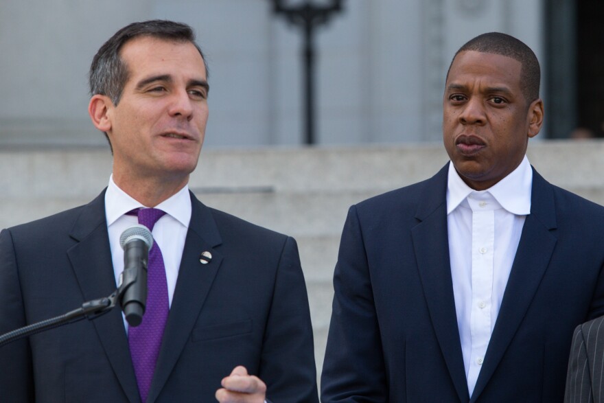 Mayor Eric Garcetti, left, and Shawn "Jay-Z" Carter announce the Made in America Festival from the steps of City Hall on April 16, 2014, in Los Angeles.