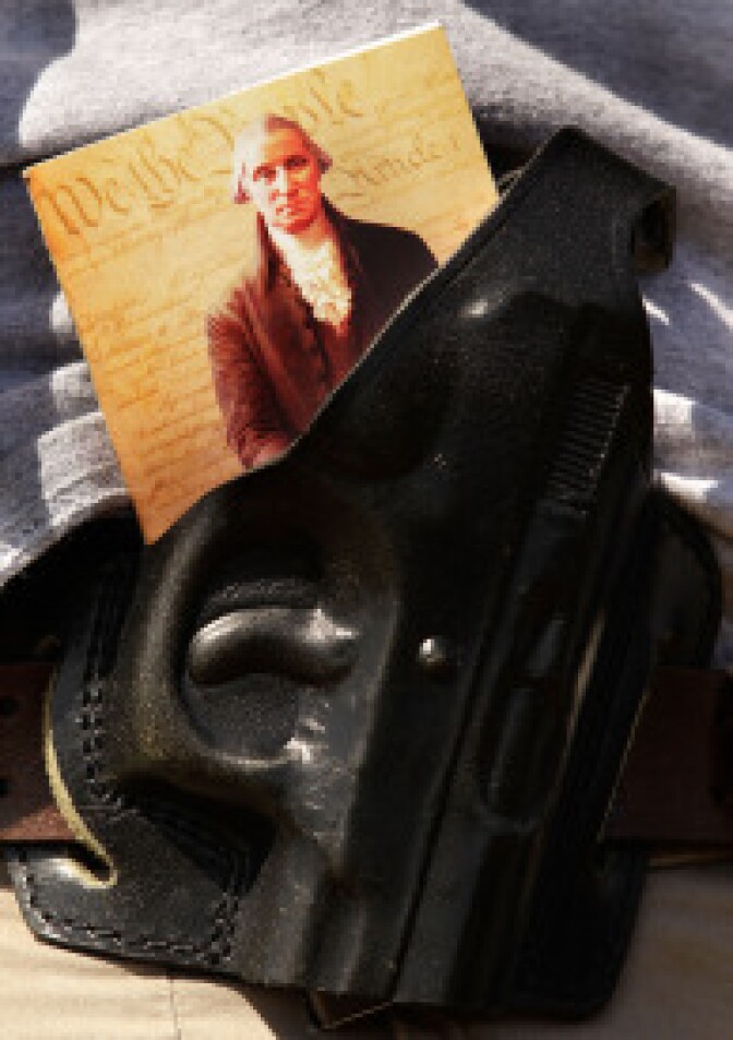 A copy of the U.S. Constitution is stuffed into a gun holster during a pro-gun rally on April 19, 2010 in Washington, DC.