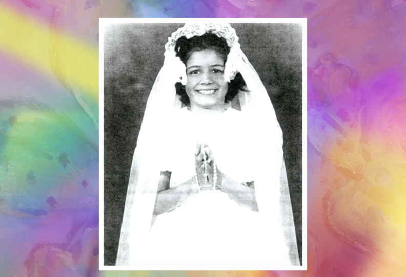 A vintage black-and-white photo of a smiling little girl in a white First Communion dress, with a rosary in her hands.