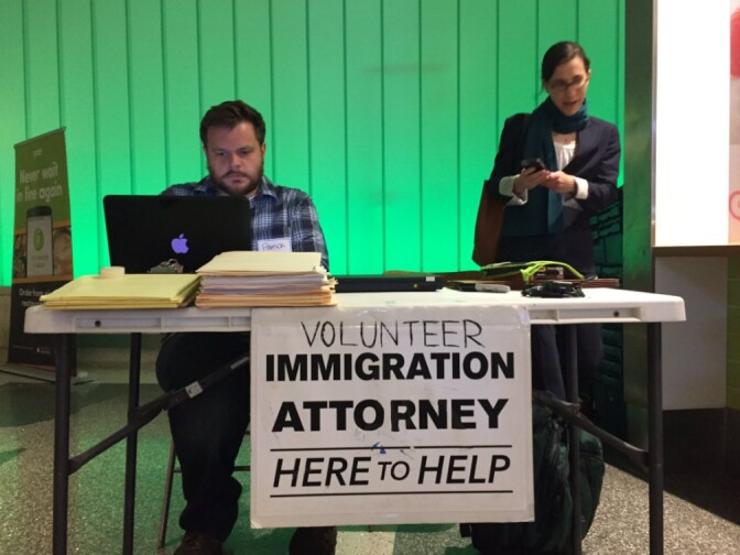 XXX, left, and Talia Inlender, a senior staff attorney with Public Counsel, prepare to answer questions from travelers and relatives at the Tom Bradley International Terminal at LAX on Monday, March 6, 2017.