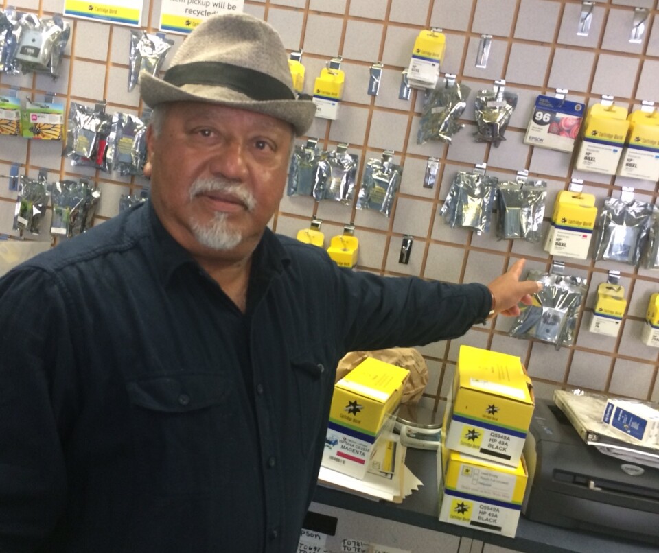 Omar Huda, 65, points out printer supplies in his Pasadena store. He says his family's shrimp business in Bangladesh was destroyed after a 2007 cyclone, forcing his cousins to the capital, Dhaka. 
